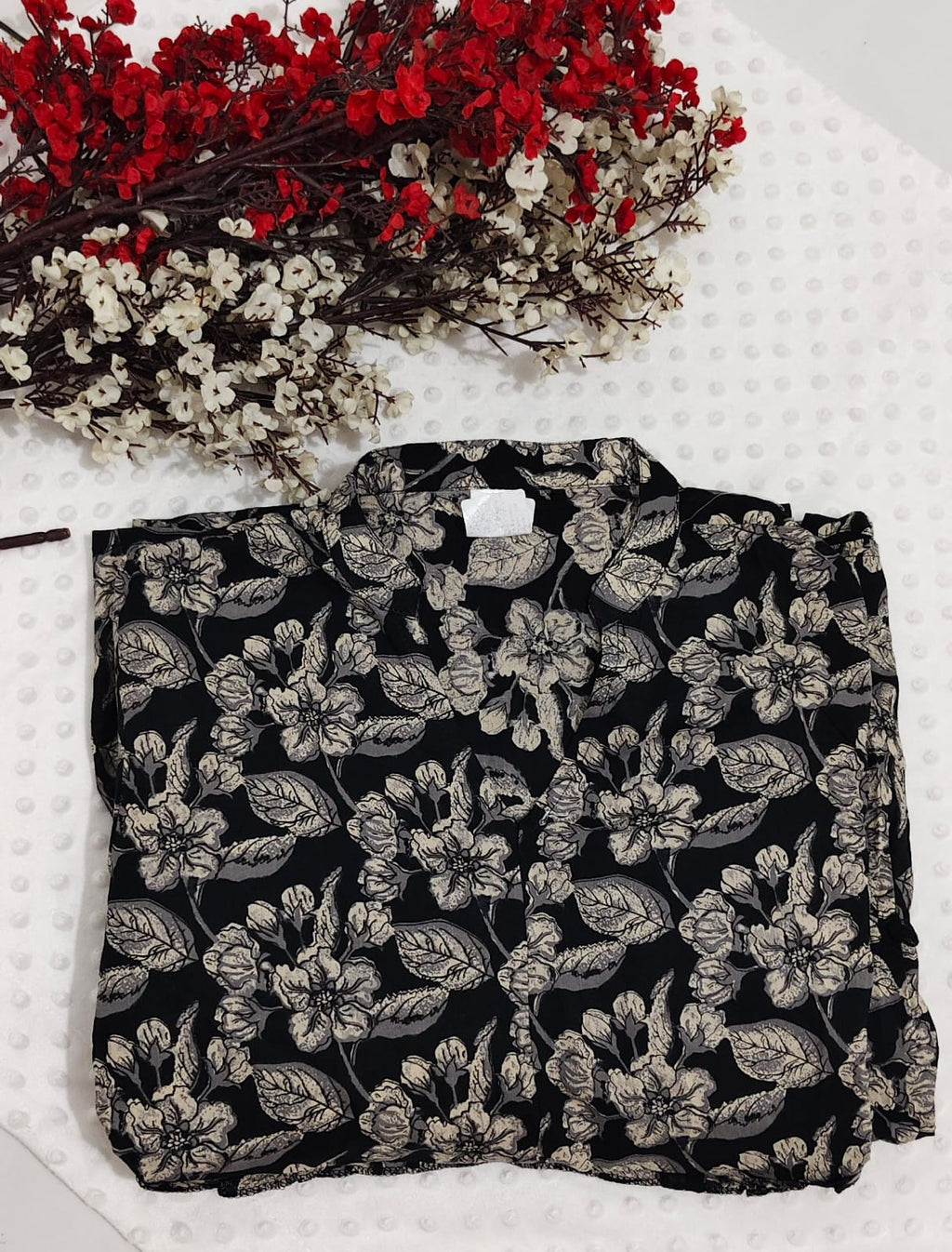 Black base with beige floral print